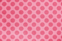 The Texture Of Genuine Leather. Pink Polka Dot Background.