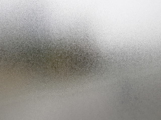 Transparent glass with fog up and water drop on it during winter season.Close up shot of Natural beauty effect. Background and wallpaper concept.