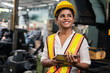 © Shutter B - Industry maintenance engineer woman dark skin wearing uniform and safety helmet under inspection and checking production process on factory station by tablet. Industry, Engineer, construction concept.