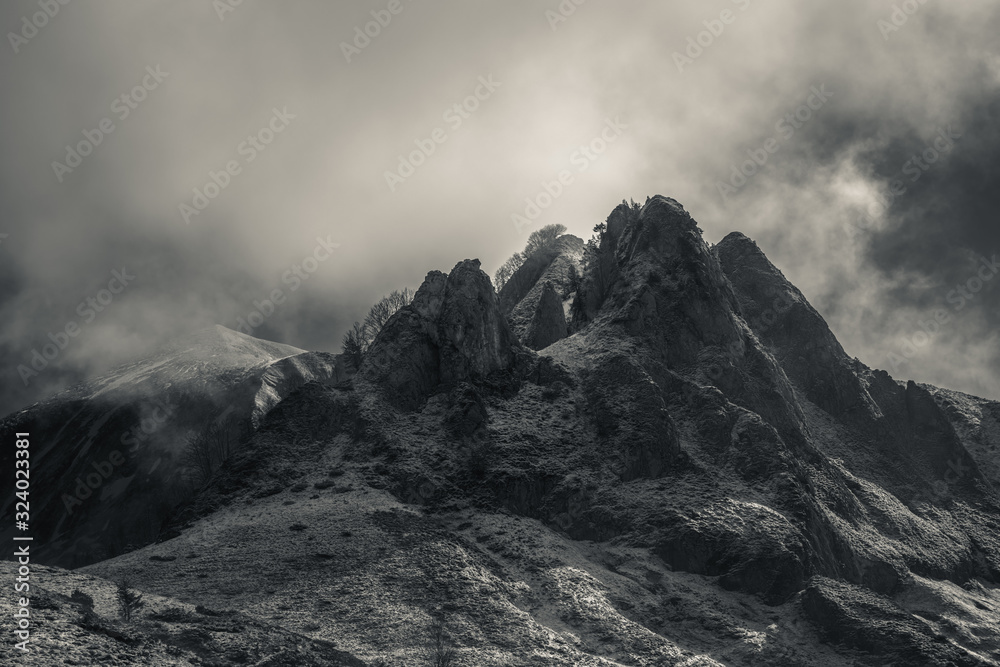 Mysterious black mountain with dramatic cloudy sky - obrazy, fototapety, plakaty 