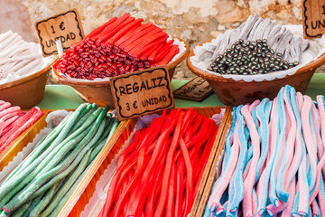 Colorful liquorice sweets for sale on Porreres Market. Regaliz, 3€/unidad (Liquorice, €3/unit). 1€/unidad (€1/unit). Porreres, Majorca, Spain