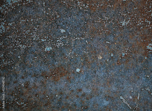 Fotografía Rusty and deteriorated old metal plate texture.