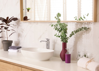 Sticker - Stylish bathroom interior with countertop, mirror and plants. Design idea