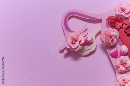 Fotografía Womens reproductive system, pink art concept with flowers, close-up, copy space