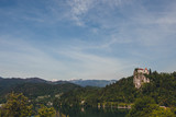 Fototapeta  - Panorama of bled castle with alps in the background.