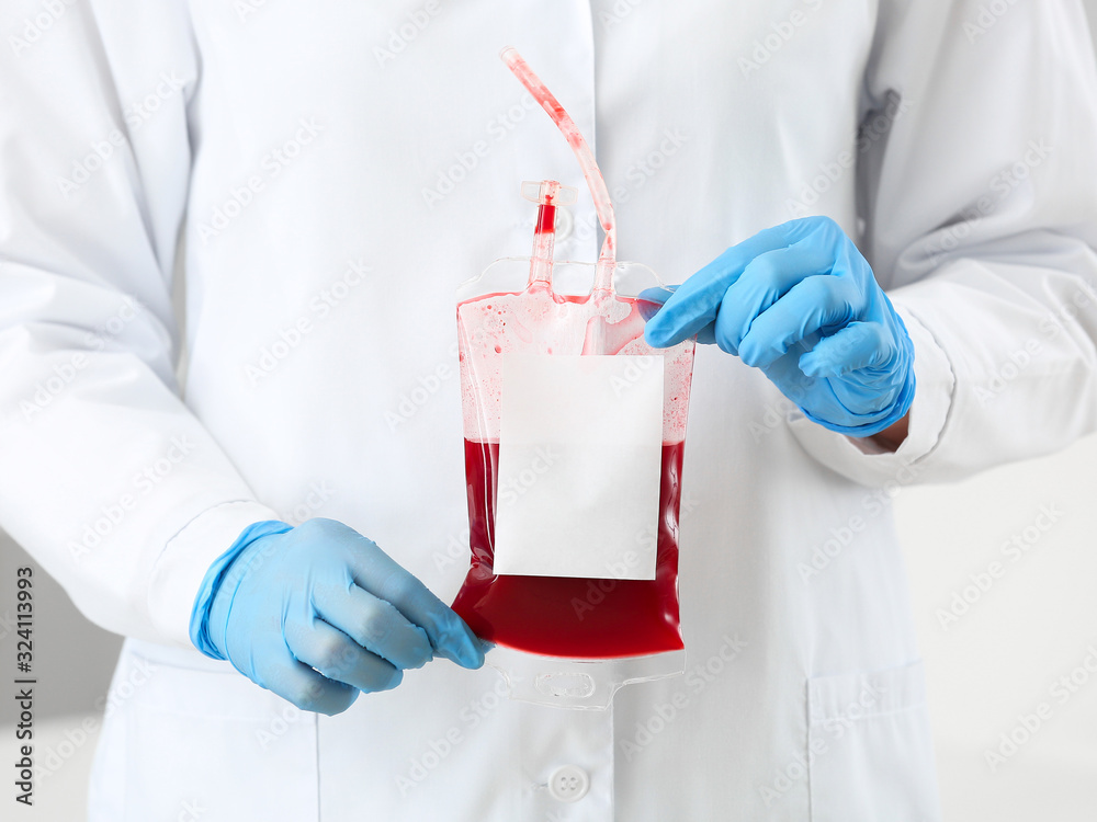 Female doctor with blood pack in hospital