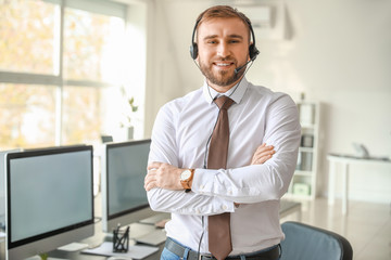 Canvas Print - Portrait of male technical support agent in office