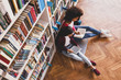 © Pixel-Shot - Young students preparing for exam in library