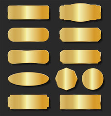 golden metal plates collection on black background