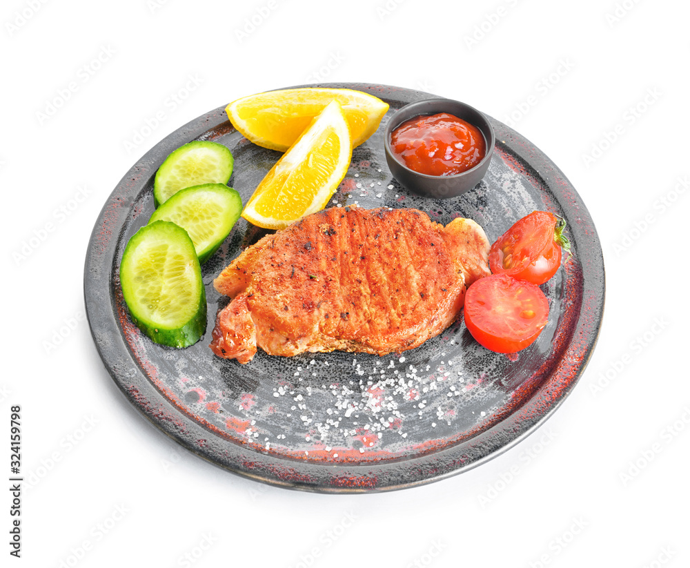 Plate with cooked pork steak, vegetables and sauce on white background