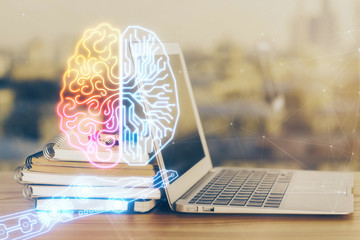 Multi exposure of work table with computer and brain hologram. Brainstorm concept.