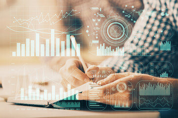 Multi exposure of two men planing investment with stock market forex chart.