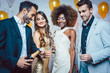 © Kzenon - Man, on new year or birthday party opening bottle of champagne