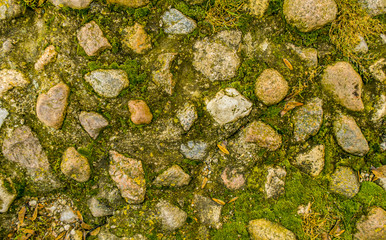 Wall Mural - Rock surface stone texture grungy stones on ground as natural background toned in warm colors