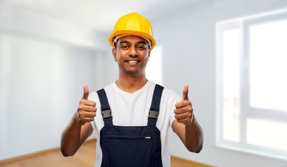 Poster - profession, construction and building - happy smiling indian worker or builder in helmet showing thumbs up over empty room at new home or apartment background