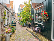 Bicycle In Small Street Kerkepad In Volendam, Noord-Holland, Netherlands
