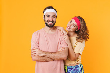 Wall Mural - Portrait of athletic young happy couple smiling and standing together