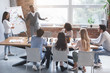 © Prostock-studio - Black guy and asian girl making presentation at office