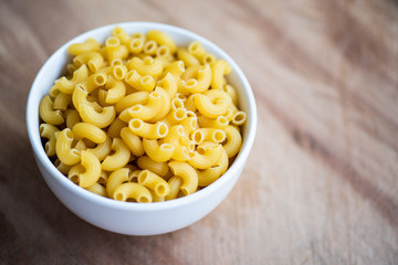 Wall Mural - Raw macaroni in a bowl.