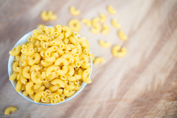 Wall Mural - Raw macaroni in a bowl.