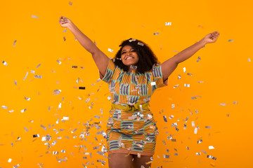 Party, holidays and birthday concept - Celebrating happiness, young woman dancing with big smile throwing confetti