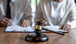 © Freedomz - Contract decree of divorce (dissolution or cancellation) of marriage, husband and wife during divorce process and signing of divorce contract, Wedding ring