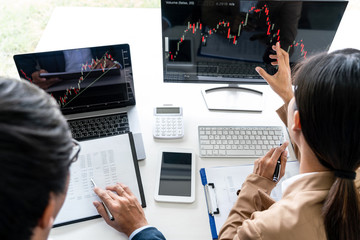 Poster - Business team partner working with computer, laptop, discussion and analyzing graph stock market trading with stock chart data planning, financial and investment concept