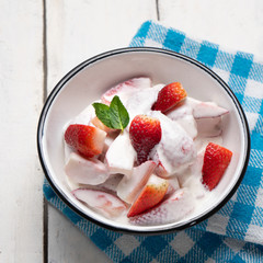 Wall Mural - Strawberries and cream dessert on white background