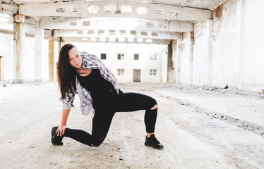 Girl dancing hip-hop in old industrial building.  Young girl art dance. Street urban lifestyle. 