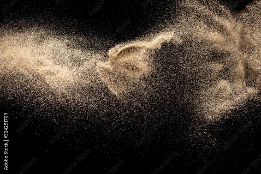 Brown colored sand splash.Dry river sand explosion isolated on black background. Abstract sand cloud. - obrazy, fototapety, plakaty 