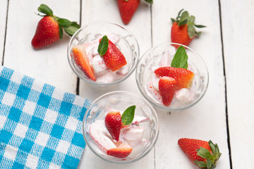 Wall Mural - Strawberries and cream dessert on white background