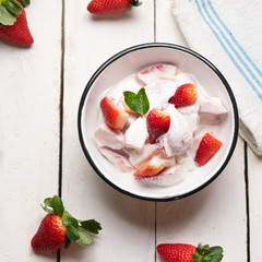 Wall Mural - Strawberries and cream dessert on white background