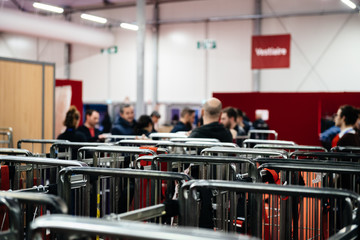 Silhouettes of people seen in background of cargo carriers at the annual winemaker fair congress in France