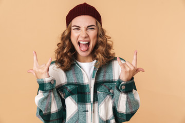 Sticker - Photo of sassy young woman screaming and making horns with fingers