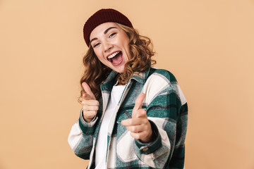 Poster - Photo of pretty joyful woman pointing fingers at camera and smiling