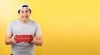 Pizza delivery happy smile Asian man,isolated on yellow background in studio With copy space.