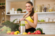 © Prostock-studio - Healthy food. Sporty woman preparing healthy smoothie with blender