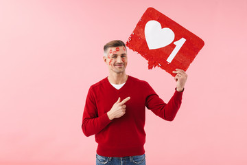 Wall Mural - Man holding blank with like symbol.