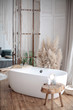 Adorable shabby chic bathroom interior in bright colors. gold plumbing. Home interior. Selective focus. table with a mirror and makeup