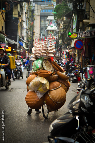 Cuadros en Lienzo Peddler on a bicycle in Hanoi, Vietnam