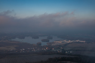 Wall Mural - Sunrise time on Radobyl hill over valley of river Labe and Litomerice town