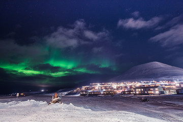 Wall Mural - the polar arctic northern lights hunting aurora borealis sky star in norway travel photographer man 