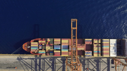 Aerial drone top down photo of industrial container logistics loading - unloading ship terminal in Mediterranean destination port