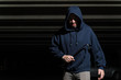 © AntonioDiaz - Robber With Tool Wearing Hoodie At Night