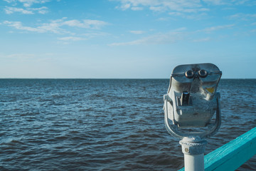 telescopic pier viewer on bokeelia pier in pine island, florida.