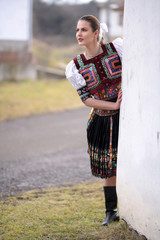 Beautiful slovak woman in traditional costume. Slovak folklore.