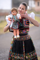 Beautiful slovak woman in traditional costume. Slovak folklore.