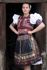 Beautiful slovak woman in traditional costume. Slovak folklore.