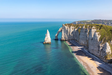 Rocks on the coast of the English channel strait. Etretat village, Normandy region, France.