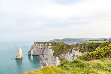 Wall Mural - Rocks on the coast of the English channel strait. Etretat village, Normandy region, France.